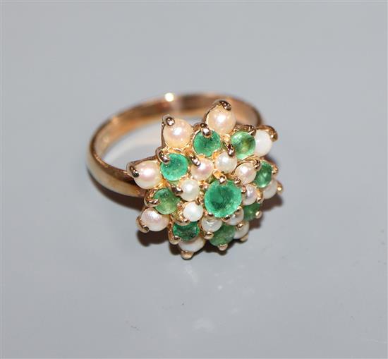 A 9ct gold, emerald and seed pearl cluster ring, size L.